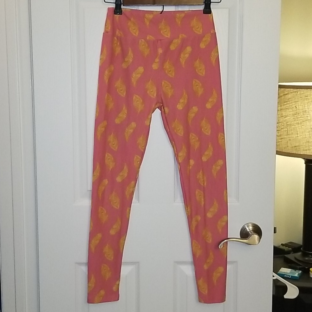 Pink leggings with yellow feather design EUC